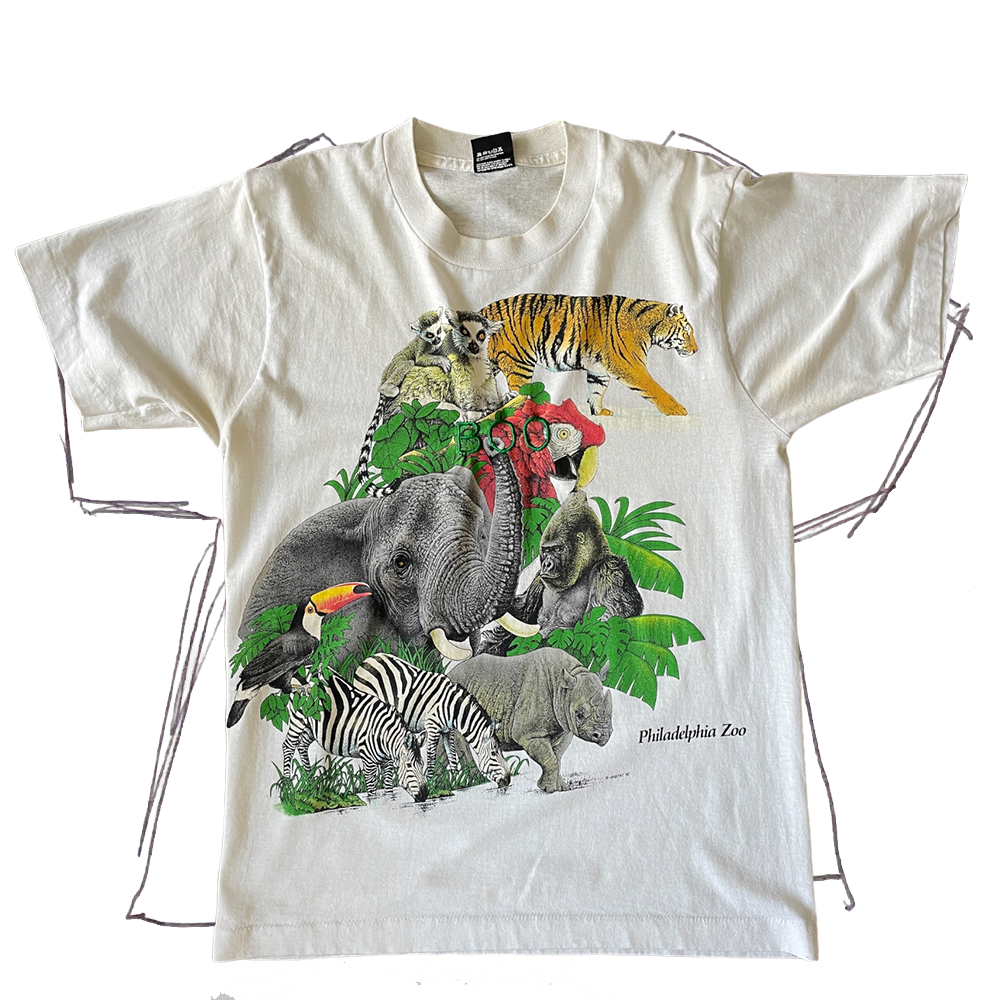 front of thsirt, zoo animal graphic with green "boo" embroidery in center